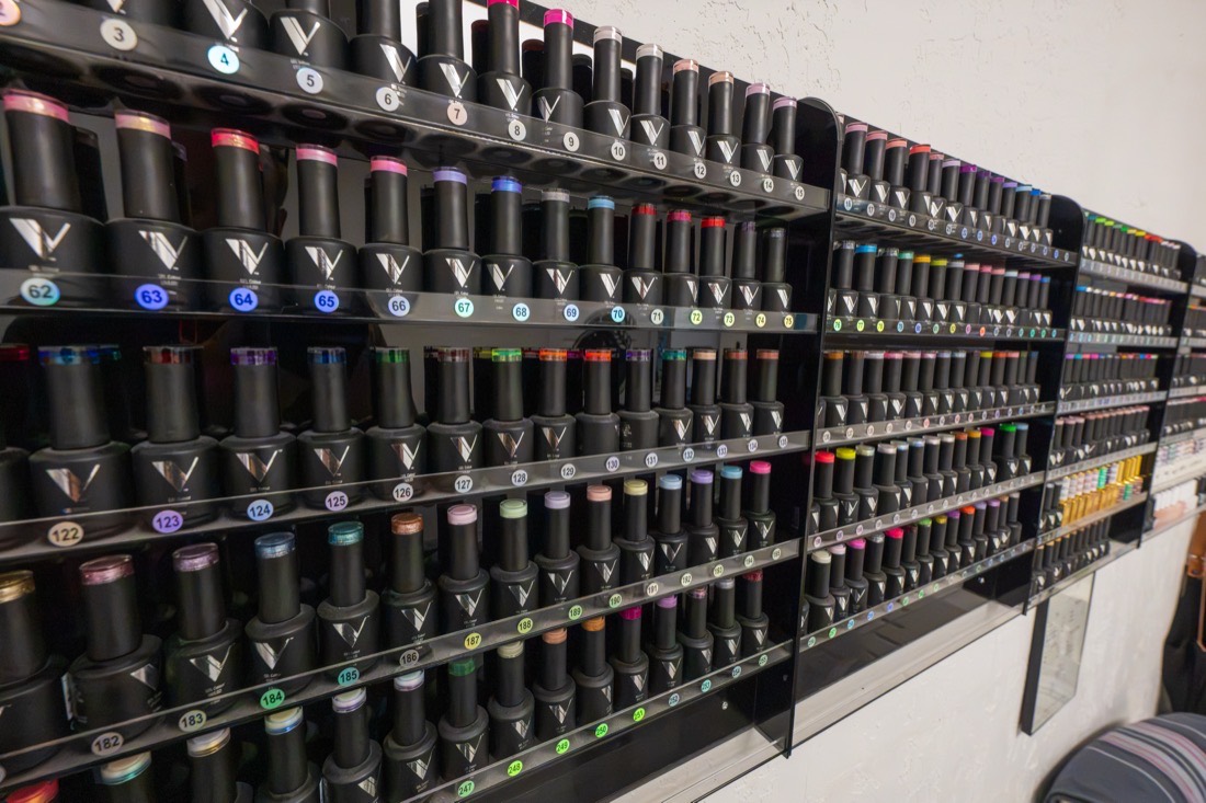 Wall of gel polish colors in the nail room